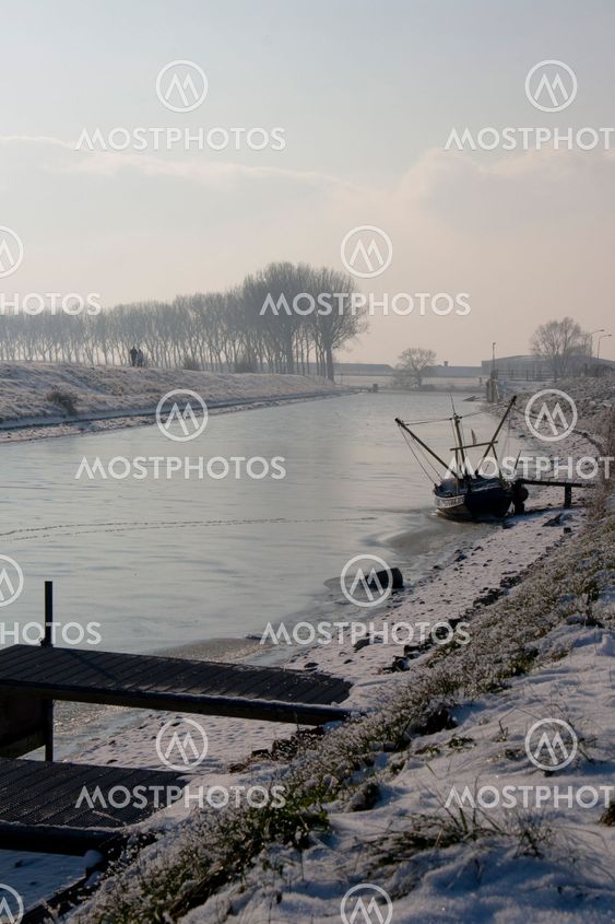 frozen creek in arnemuiden