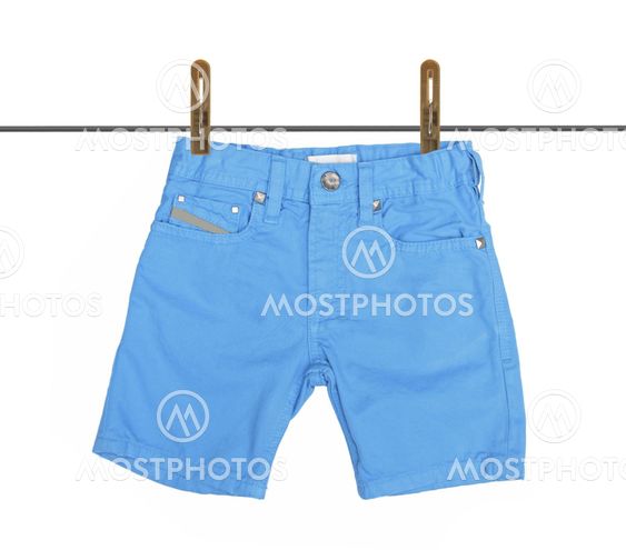 Blue jeans shorts with drying on clothesline isolated on white