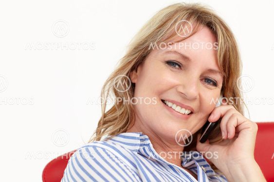 Mid age businesswoman using cellphone