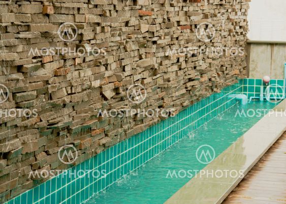 Brick wall and pond.