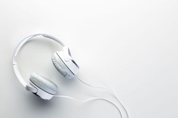White headphones on white background close up