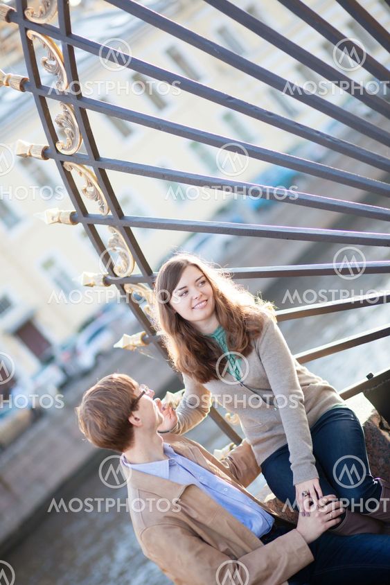 Young couple near the entrance to Summer garden in Saint-Petersburg, Russia