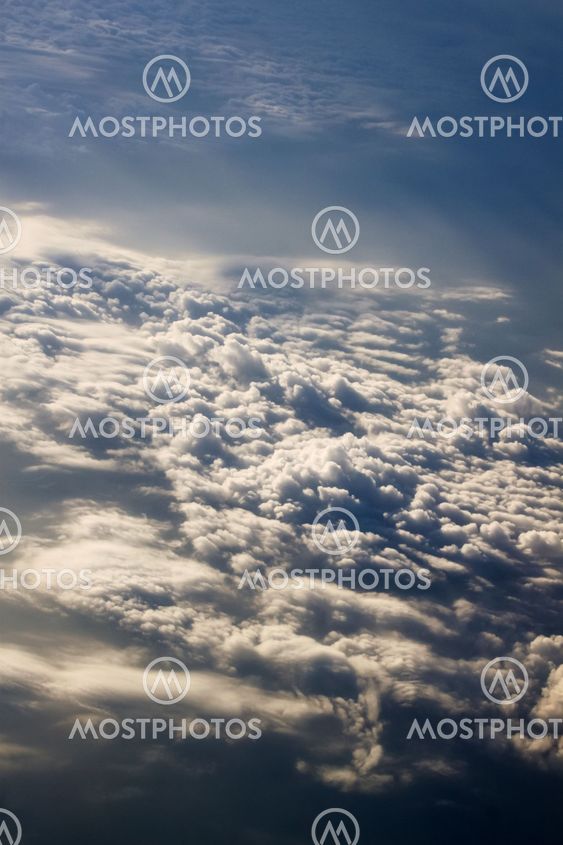 dramatic blue sky with clouds and sun rays