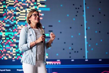 Speaker On Stage At Event Talking