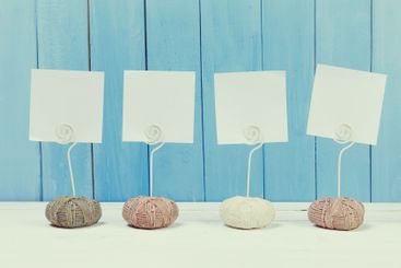 Cute home decor card holders on blue wooden background