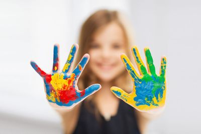 girl showing painted hands