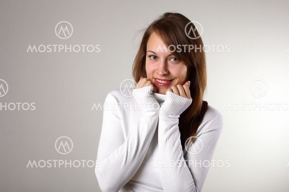 Young girl in white sweater