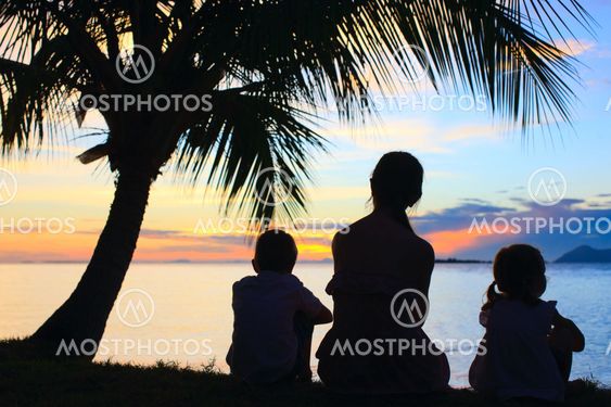 Silhouettes of mother and two kids