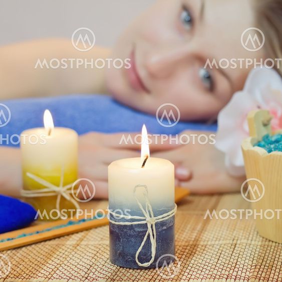 Aroma candle closeup before woman