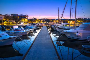 Colorful dusk harbor view in town of Krk, archipelago of...