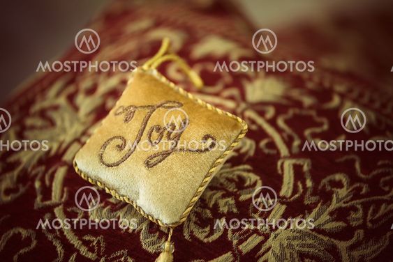 Golden decorative pillow ornament