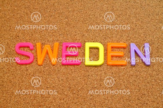 Sweden in colorful toy letters on cork background
