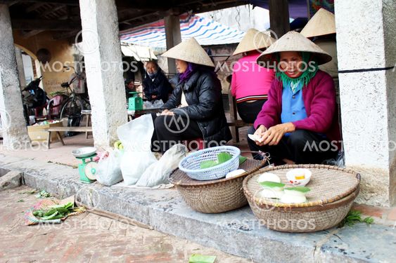 farmer woman selling rice cakes