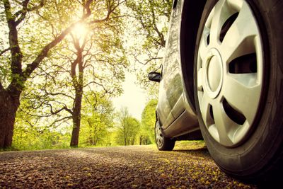 Car on asphalt road in spring