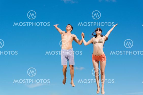 couple jumping together