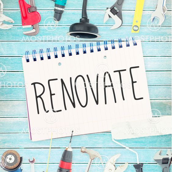 Renovate against tools and notepad on wooden background