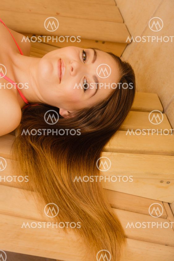 Portrait of woman relaxing in sauna. Spa wellbeing