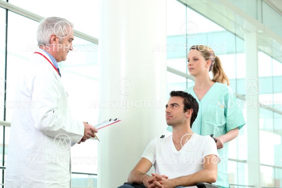 Nurse pushing patient in wheelchair