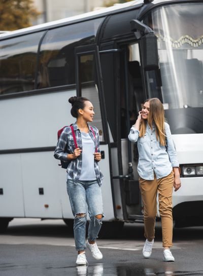 selective focus of multicultural women with backpacks...