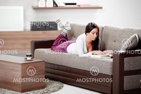 Young woman reading book