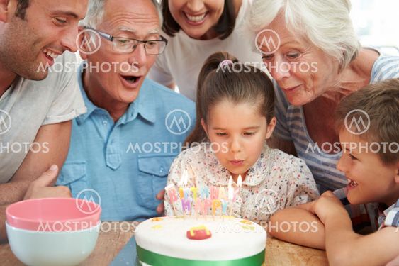 Multi Generation Family Celebrating Daughter's Birthday