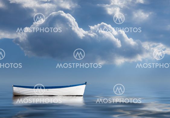 Old rowing boat marooned at sea