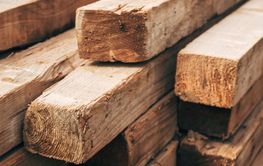 Pile of stacked constriction timber wood on a site