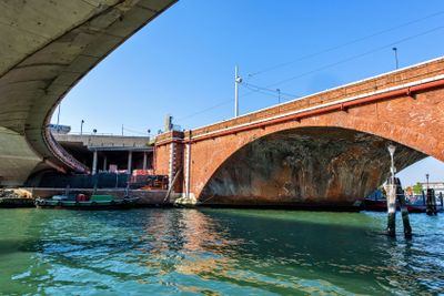 Daylight view to tall bridge facade made from brick
