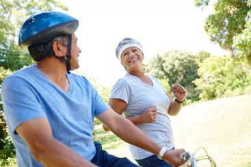 Bike, fitness and old couple in park together for cardio...