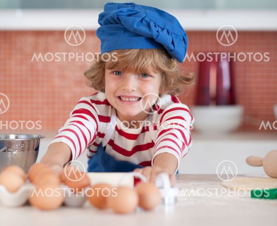 Smiling child with eggs