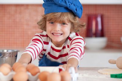 Smiling child with eggs 