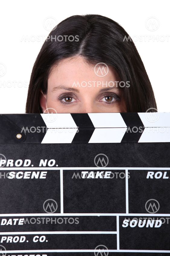 Woman holding movie clapper