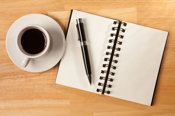 Blank Spiral Note Pad, Cup and Pen on Wood