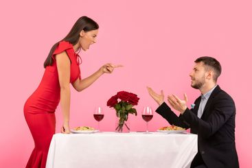 Couple Having Quarrel During Romantic Date On Yellow...