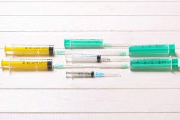 Top view of many syringes prepared for injection at...