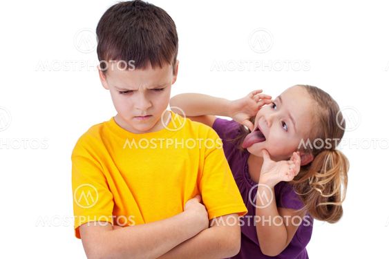 Young girl mocking boy - isolated