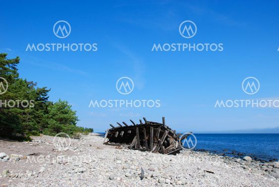 Wooden shipwreck by the coast