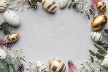 Easter eggs frame decorating a gray surface with...