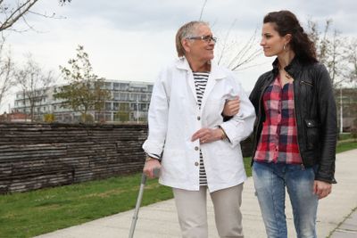 Woman strolling with an elderly lady