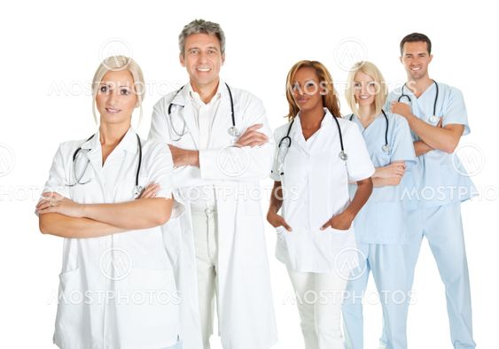 Team of doctors standing in line isolated on white