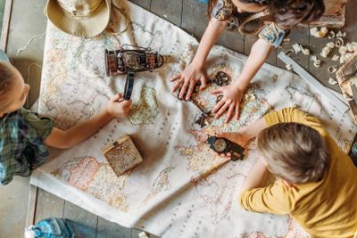 Overhead view of little kids travelers sitting together...