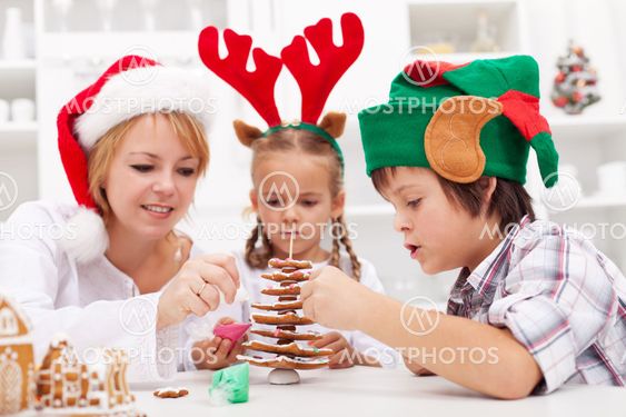 Family decorating the gingerbread christmas tree