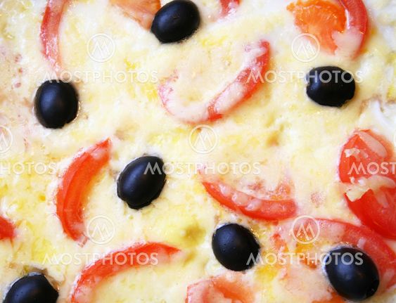 Omelette with tomatoes, black olives and cheese