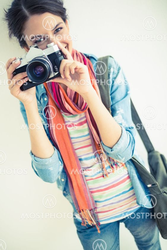 Attractive brunette taking a photograph