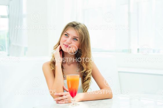 Portrait of a cute woman in a city cafe