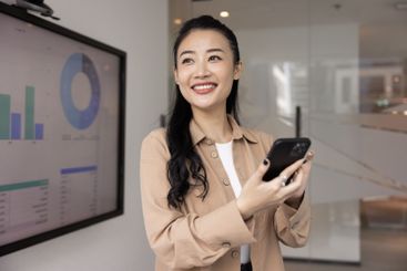 Positive beautiful young Asian project manager girl...