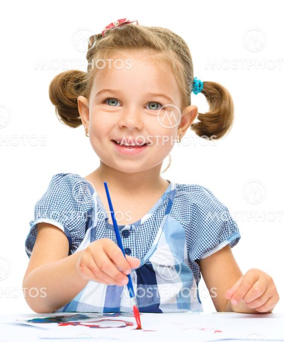 Little girl is painting with gouache