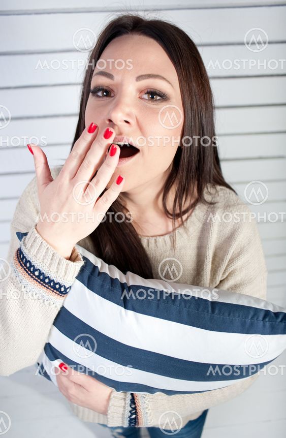 The young girl with pleasure yawns