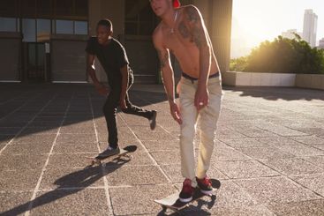 Training, skating and friends with skateboard, sport and...