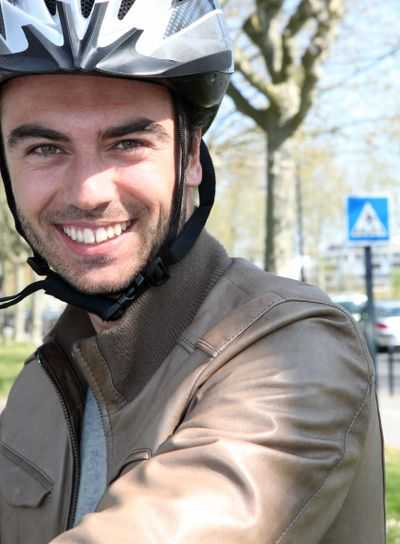 Cyclist wearing a helmet
